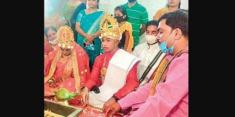 The couple taking vows at SSCCH on Saturday. 