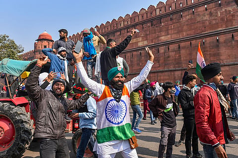 Farmers participate in the 'Kisan Gantantra Parade' after breaking police barricades at Ghazipur border during their protest against Centre's farm reform laws on the occasion of 72nd Republic Day near