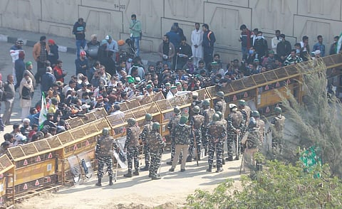 Security personnel stand near barricades at  Ghazipur border during the proposed 'chakka jam' by farmers. (Photo | Shekhar Yadav, EPS)