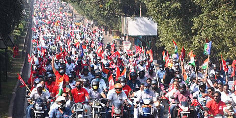 Steel plant employees and workers led by the joint action committee taking out a two wheeler rally to protest against privatisation of VSP. (Photo | EPS)