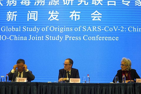 Marion Koopmans, right, and Peter Ben Embarek, center, of a World Health Organization team look over at their Chinese counterpart Liang Wannian, left, during a WHO-China Joint Study. (Photo | AP)