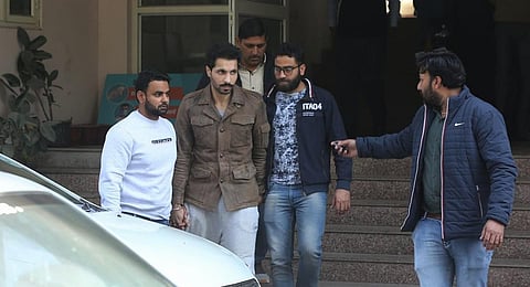 Accused Deep Sidhu with officers of Special Cell in Janakpuri, New Delhi. (Photo | Express)