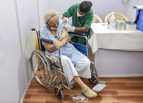 An elderly person being administered the COVID-19 vaccine, during a countrywide inoculation drive, at BKC jumbo vaccination centre . (Photo | PTI)