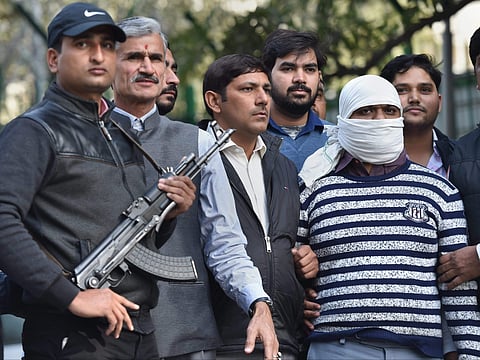 Ariz Khan alias Junaid one of the most wanted Indian Mujahideen terrorist being taken to a court by Delhi Police Special Cell after his arrest in New Delhi on 14 February 2018. (File Photo | PTI)