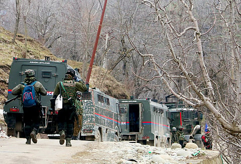 Indian Army personnel arrive to take position during an encounter with terrorists in Shopian on Monday.