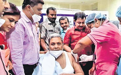 Leader of the Opposition Siddaramaiah, who recovered from Covid-19 in  August 2020, gets the jab at Victoria Hospital in Bengaluru on Monday | Express