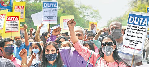 DU teachers take part in the ‘Adhikar Rally’ to protest over the financial crisis in the 12 colleges funded by Delhi govt | Shekhar Yadav