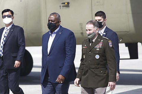 U.S. Secretary of Defense Lloyd Austin, center left, walks with United States Forces Korea, Gen. Robert B. Abrams, after Austin arrived at Osan Air Base in Pyeongtaek, South Korea. (Photo | AP)