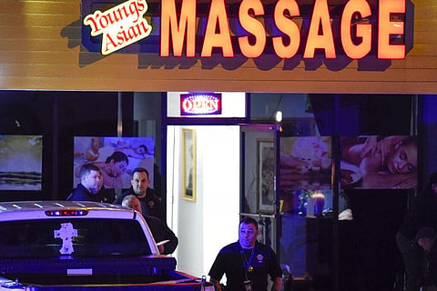 Authorities investigate a fatal shooting at a massage parlor, late Tuesday, March 16, 2021, in Woodstock, Ga. (Photo | AP)
