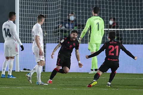 Real Sociedad's Portu, center, celebrates with teammate Real Sociedad's David Silva after scoring against Real Sociedad at Alfredo di Stefano stadium in Madrid, Spain, Monday. (Photo | AP)