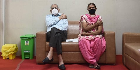 Senior Citizens sits under observation after getting his first dose of COVID-19 vaccine during the second phase of the countrywide inoculation drive in New Delhi. (Photo | Parveen Negi, EPS)