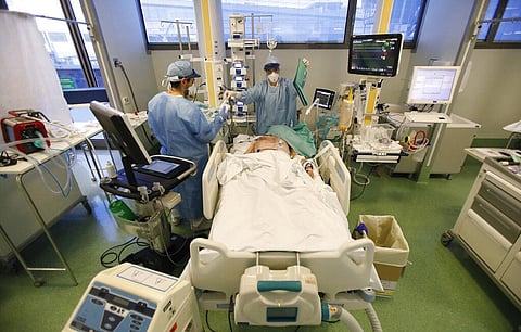 Medical staff members tend to a patient in the COVID-19 Intensive Care Unit of the Papa Giovanni XIII hospital in Bergamo, Italy (Photo | AP)