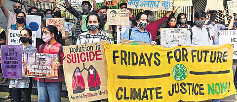 Student activists participate in a protest march demanding action against climate change in New Delhi on Friday | Parveen negi