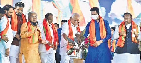 Chief Minister BS Yediyurappa and BJP state unit president Nailn Kumar Kateel (second from right) launch the party bypoll campaign at Maski on Saturday