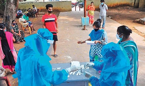 Healthcare workers collect samples for COVID testing. (Photo | Express)