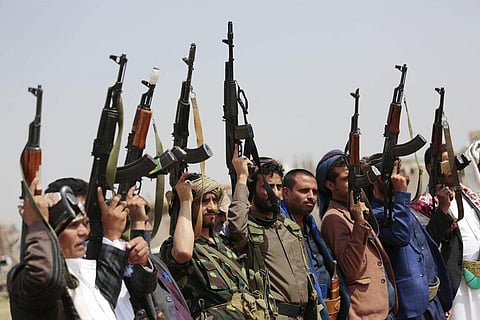 In this Aug. 22, 2020 file photo, tribesmen loyal to Houthi rebels raise their weapons during a protest against the agreement to establish diplomatic relations between Israel and the UAE. 