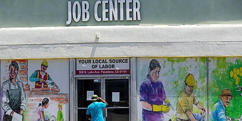 A person looks inside the closed doors of the Pasadena Community Job Center in Pasadena, Calif., during the coronavirus outbreak.  (Photo | AP)