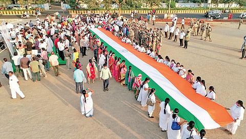 Election officials organise an awareness rally urging people to exercise their franchise in the municipal elections in Vijayawada on Thursday I Express
