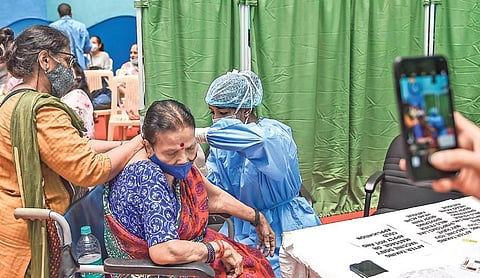 An elderly person being administered the Covid-19 vaccine in a paid centre at SRCC Hospital in Mumbai on Saturday | PTI