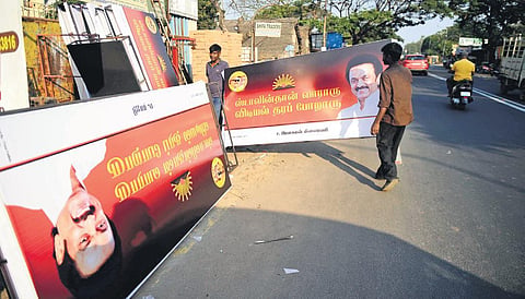 Hoardings featuring picture of DMK president MK Stalin along with the rising sun symbol near a shop in Chennai. (Photo| EPS/ Debadatta Mallick)