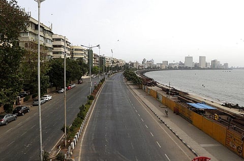 Marine Drive sea front is seen deserted during weekend lockdown in Mumbai. (Photo | AP)
