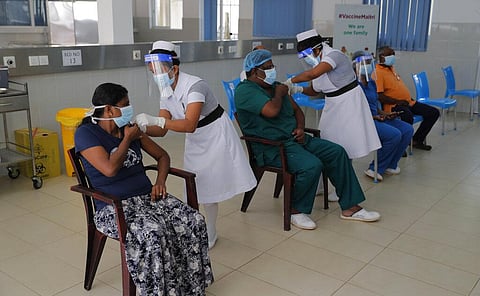 Sri Lankan nursing staff administer COVID-19 vaccines to frontline health workers in Colombo. (File Photo | AP)