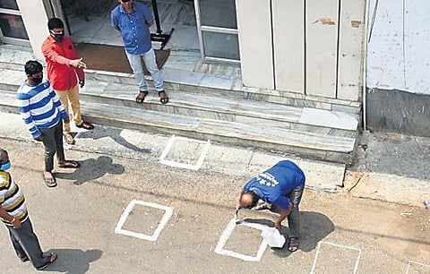Staffers at Papanna Mutton Stall draw boxes for buyers to maintain social  distance outside the shop | Vinod Kumar T