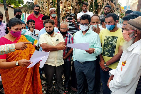 MCC commissioner Shilpa Nag and MUDA commissioner Natesh visit the site of Syed Issaq’s library in Mysuru on Monday | Express