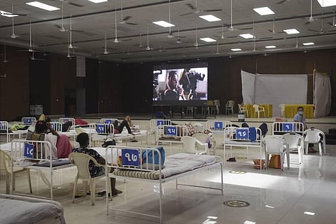 Covid-19 patients watch a movie at a COVID Care Centre in Surat, Monday, April 19, 2021. (Photo | PTI)