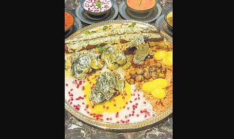 ​The platter includes Gold Leaf kababs Kashmiri lamb seekh kababs, old Delhi lamb chops, Rajput chicken kababs, Mughlai koftas and malai chicken roast served on a bed of saffron-infused biryani.