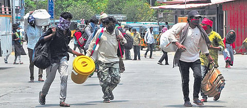 Migrant workers from other states travelling to their native place in Srikakulam from Vizag bus station on Tuesday I G Satyanarayana