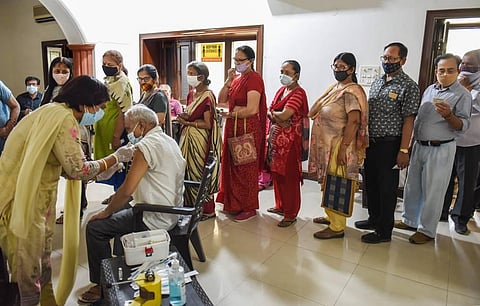 A medic administers a COVID-19 vaccine to a man during a vaccination drive, in Gurugram, Wednesday, April 21, 2021. (Photo | PTI)