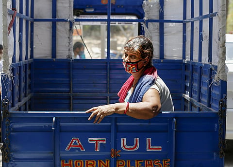 A COVID-19 positive patient waits in a tempo to be admitted in a hospital in Ahmedabad on Friday. (Photo | PTI)