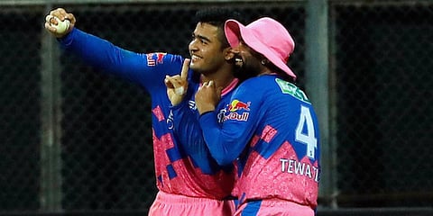 Riyan Parag and Rahul Tewatia of Rajasthan Royals celebrate the wicket of KKR's Rahul Tripathi in an IPL 2021 game in Mumbai. (Photo| ANI)