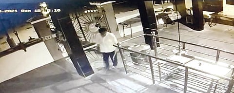 A visual from the CCTV camera at the temple showing the thief carrying iron rods | Express