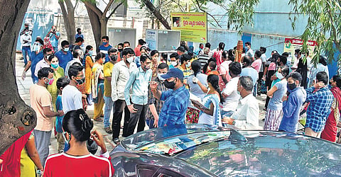 People wait to get tested for Covid-19 at the Musheerabad PHC in Hyderabad, on Sunday | S Senbagapandiyan