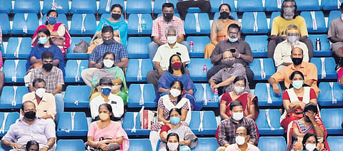 Beneficiaries waiting for their turn following Covid protocol at the mass vaccination centre at Jimmy George Indoor Stadium in the capital | B P Deepu