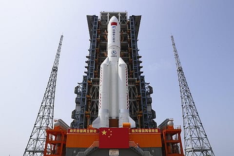 In this photo released by Xinhua News Agency, the core module of China's space station, Tianhe, on the the Long March-5B Y2 rocket is moved to the launching area. (Photo | AP)