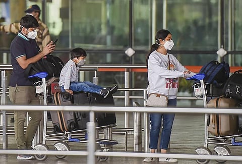 Passengers stand in a queue as they arrive at an airport (File Photo | PTI)