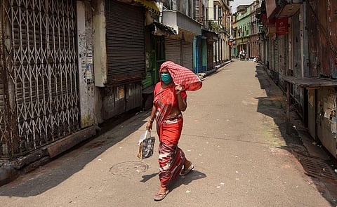 File photo of a woman walking on a deserted street in Kolkata (Photo | PTI)