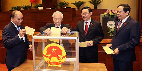 (From left) Vietnamese leaders including President Nguyen Xuan Phuc, Communist General Secretary Nguyen Phu Trong and newly elected PM Pham Minh Chinh (R). (Photo| AP)