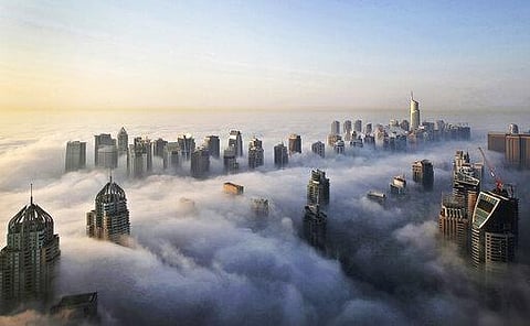 In Oct. 5, 2015 file photo, a thick blanket of early morning fog partially shrouds the skyscrapers of the Marina and Jumeirah Lake Towers districts of Dubai. (Photo | AP)