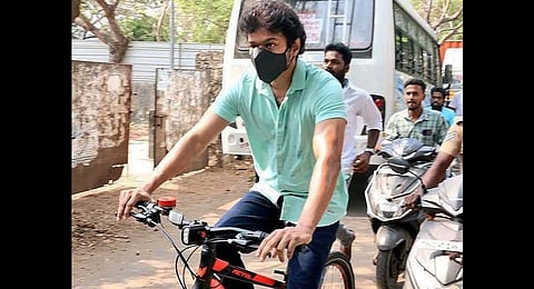 Actor Vijay going to the polling booth via cycle, in Chennai on Tuesday. (Photo | EPS)