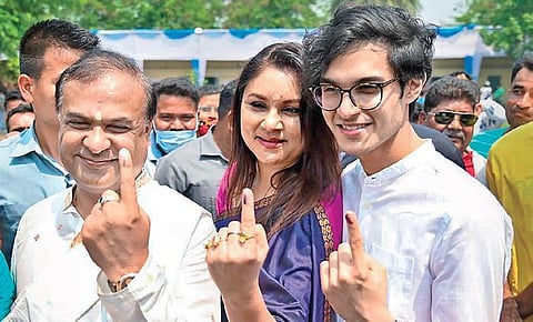 BJP candidate Himanta Biswa Sarma with his wife and son after casting their votes at a polling station at Amingaon in Kamrup district on Tuesday. (Photo | PTI)
