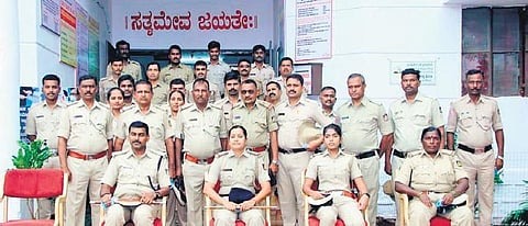 SP D L Nagesh and SI Kumari Sangeetha S (sitting, first and second from left) and other staffers of Bidar police station beat hundreds of police stations in the state