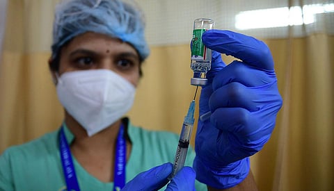 A health worker during the COVID-19 vaccination drive in Bengaluru. (Photo | Shriram BN, EPS)