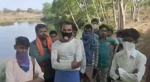 Locals of Nandanpur village gather at Runj river on Tuesday. (Screengrab)