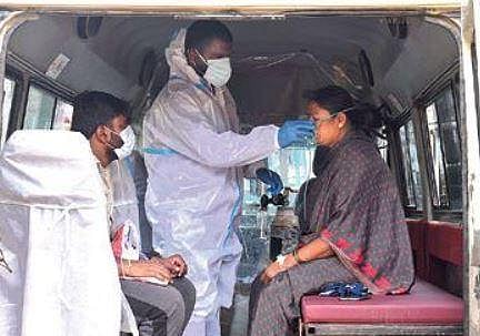 A woman being given oxygen in  an ambulance, in Bengaluru  on Thursday | vinod kumar t