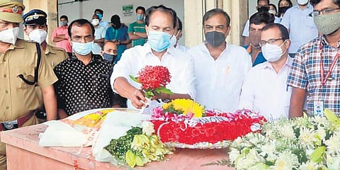 Thrikkakara MLA PT Thomas pay respects to Soumya Santosh, who was killed in a mortar shell attack in Israel, when her body was brought to the Kochi airport. (Photo| EPS)