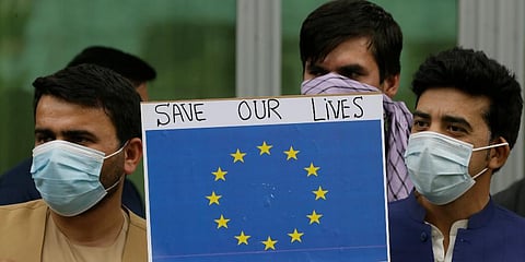 In this Friday, April 30, 2021, photo former Afghan interpreters hold placards during a protest against the US government and NATO in Kabul. (Photo | AP)